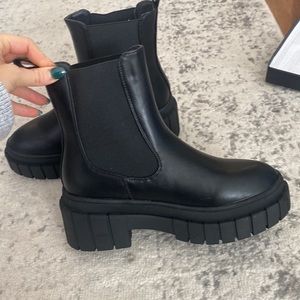 Black slip on combat boots. Never worn. Ordered off Amazon. Size 7. True to size